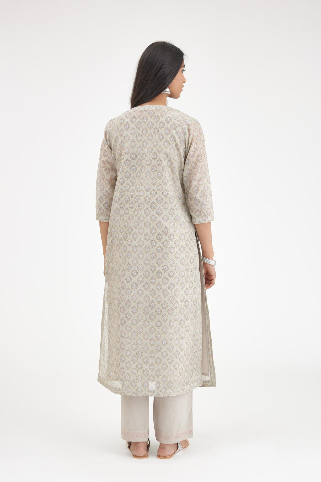 Grey silk Chanderi straight kurta set with all-over hand block print and detailed with silver zari quilting and sequins hand work.