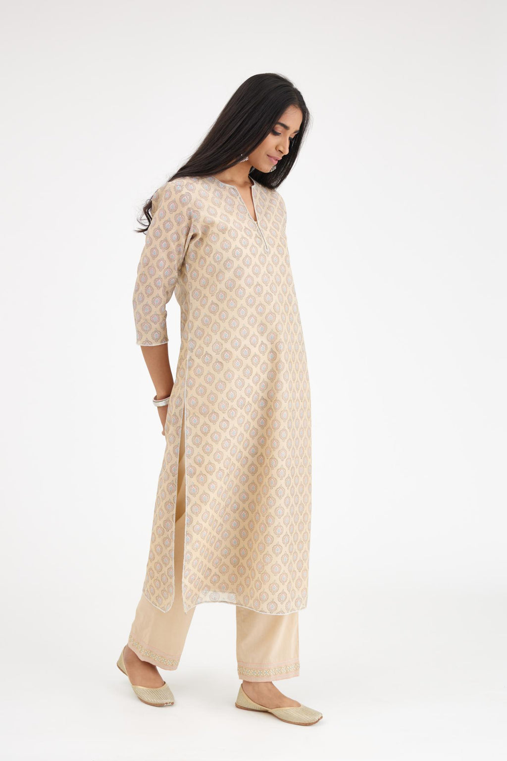 Beige silk chanderi straight kurta set with all-over hand block print and silver bugle beads detailing.