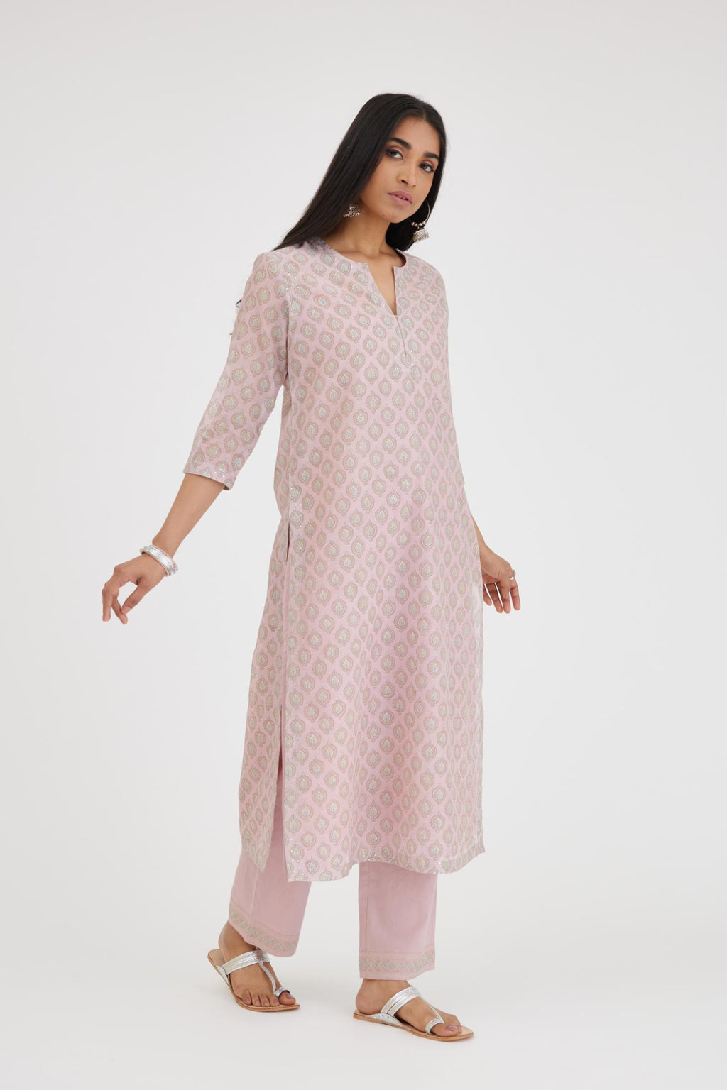 Pink silk Chanderi straight kurta set with all-over hand block print and detailed with silver zari quilting and sequins hand work.