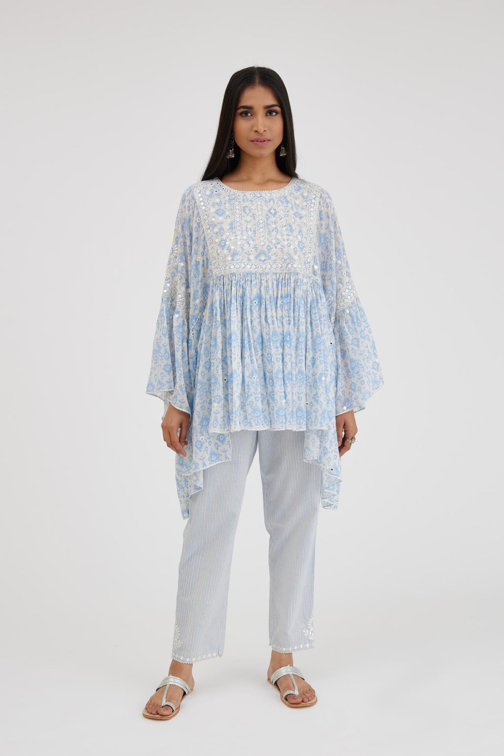 Ikat design blue and off white hand block printed cotton easy fit top with flared sleeves and hem, paired with hand-block printed striped Cotton comfortable fit pant with all-over elasticated waisband.