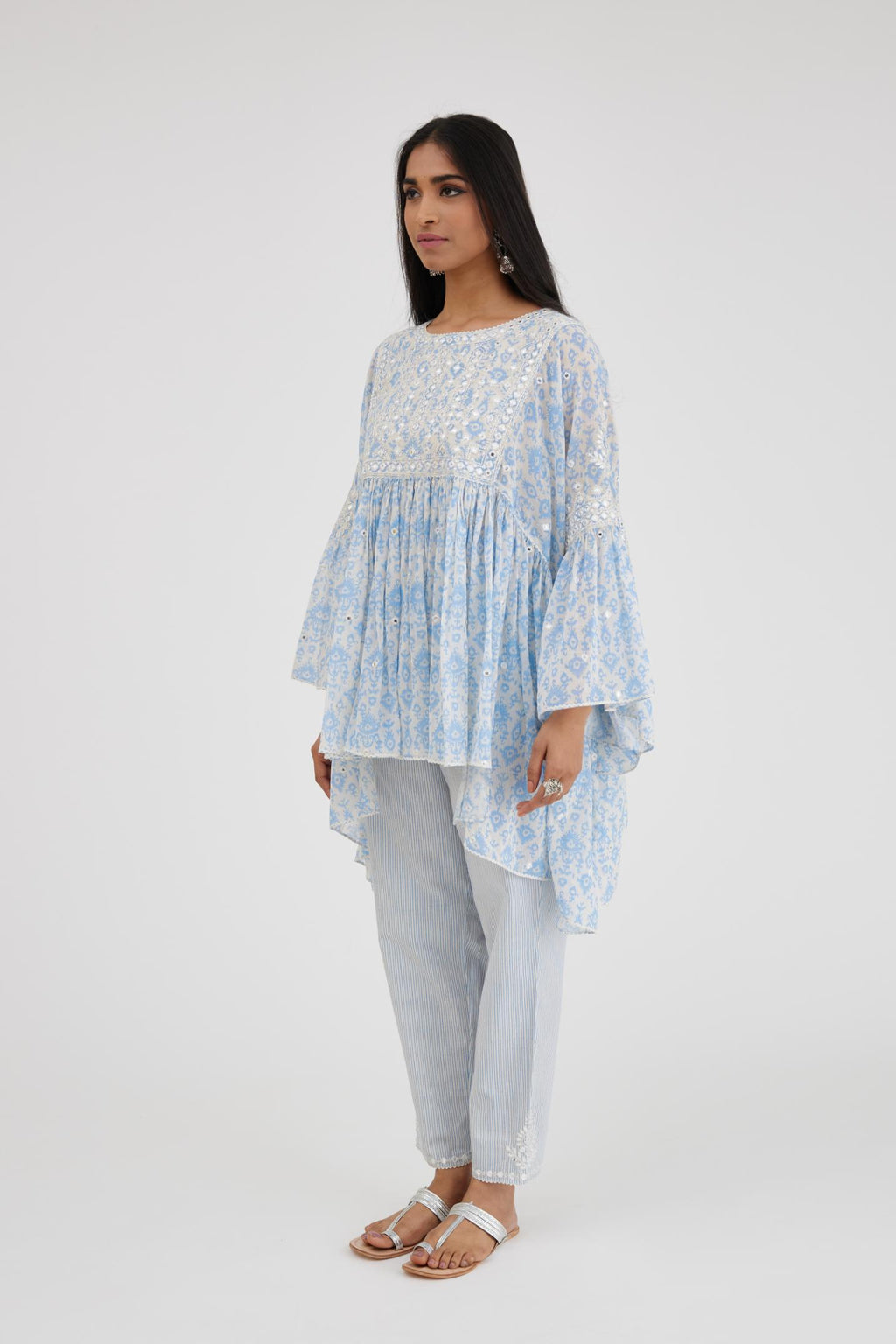 Ikat design blue and off white hand block printed cotton easy fit top with flared sleeves and hem, paired with hand-block printed striped Cotton comfortable fit pant with all-over elasticated waisband.