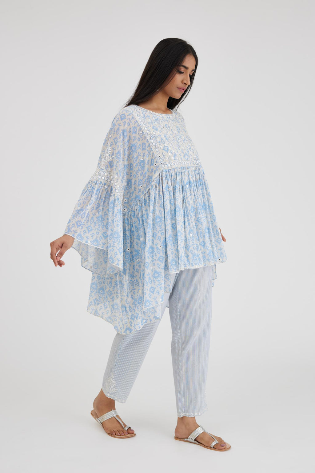 Ikat design blue and off white hand block printed cotton easy fit top with flared sleeves and hem, paired with hand-block printed striped Cotton comfortable fit pant with all-over elasticated waisband.