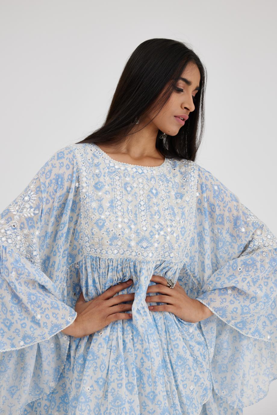 Ikat design blue and off white hand block printed cotton easy fit top with flared sleeves and hem, paired with hand-block printed striped Cotton comfortable fit pant with all-over elasticated waisband.