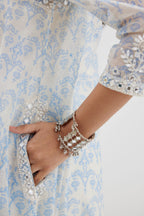 Blue and off white cotton chanderi Ikat design hand-block printed A-line short kurta set with V-neck and asymmetric hem.