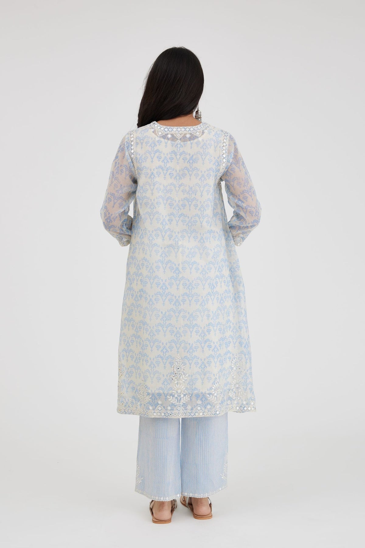 Blue and off white cotton chanderi Ikat design hand-block printed A-line short kurta set with V-neck and asymmetric hem.