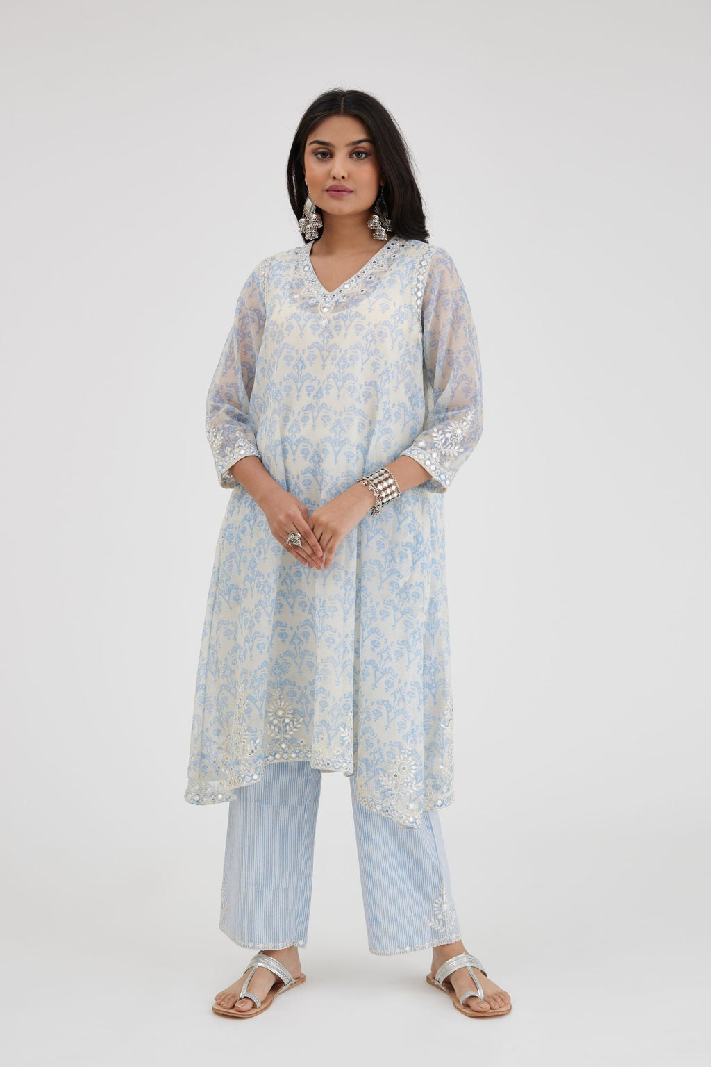 Blue and off white cotton chanderi Ikat design hand-block printed A-line short kurta set with V-neck and asymmetric hem.