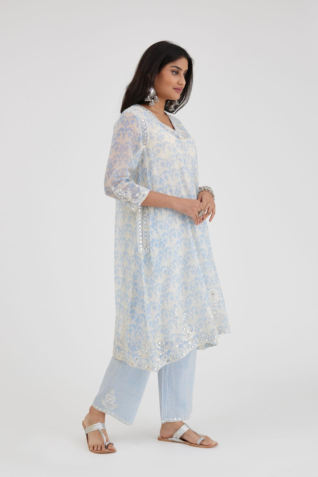 Blue and off white cotton chanderi Ikat design hand-block printed A-line short kurta set with V-neck and asymmetric hem.