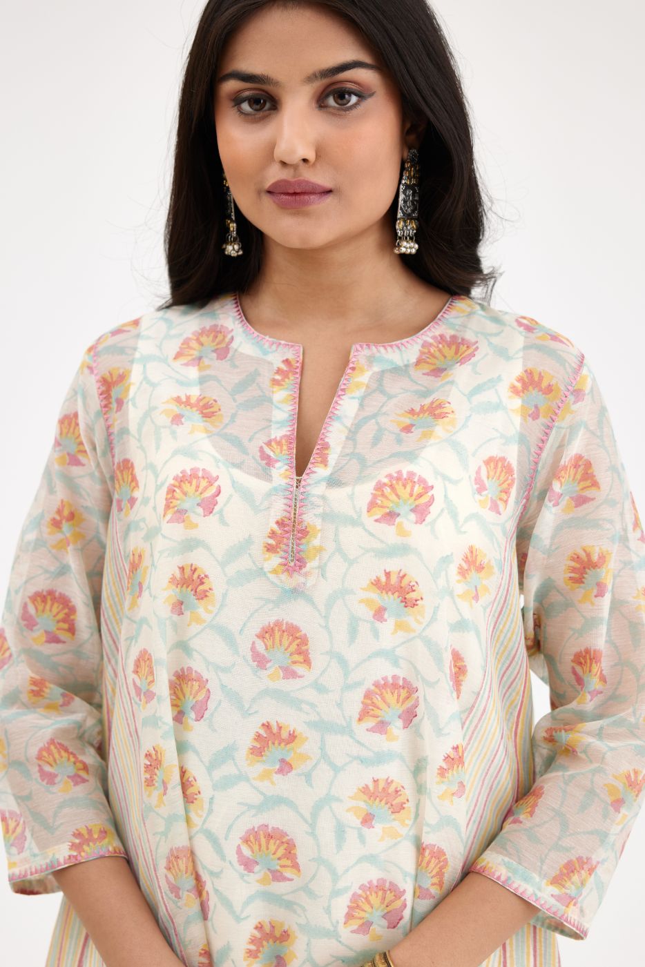 Pink and blue hand block printed cotton chanderi kurta set with asymmetric hem.