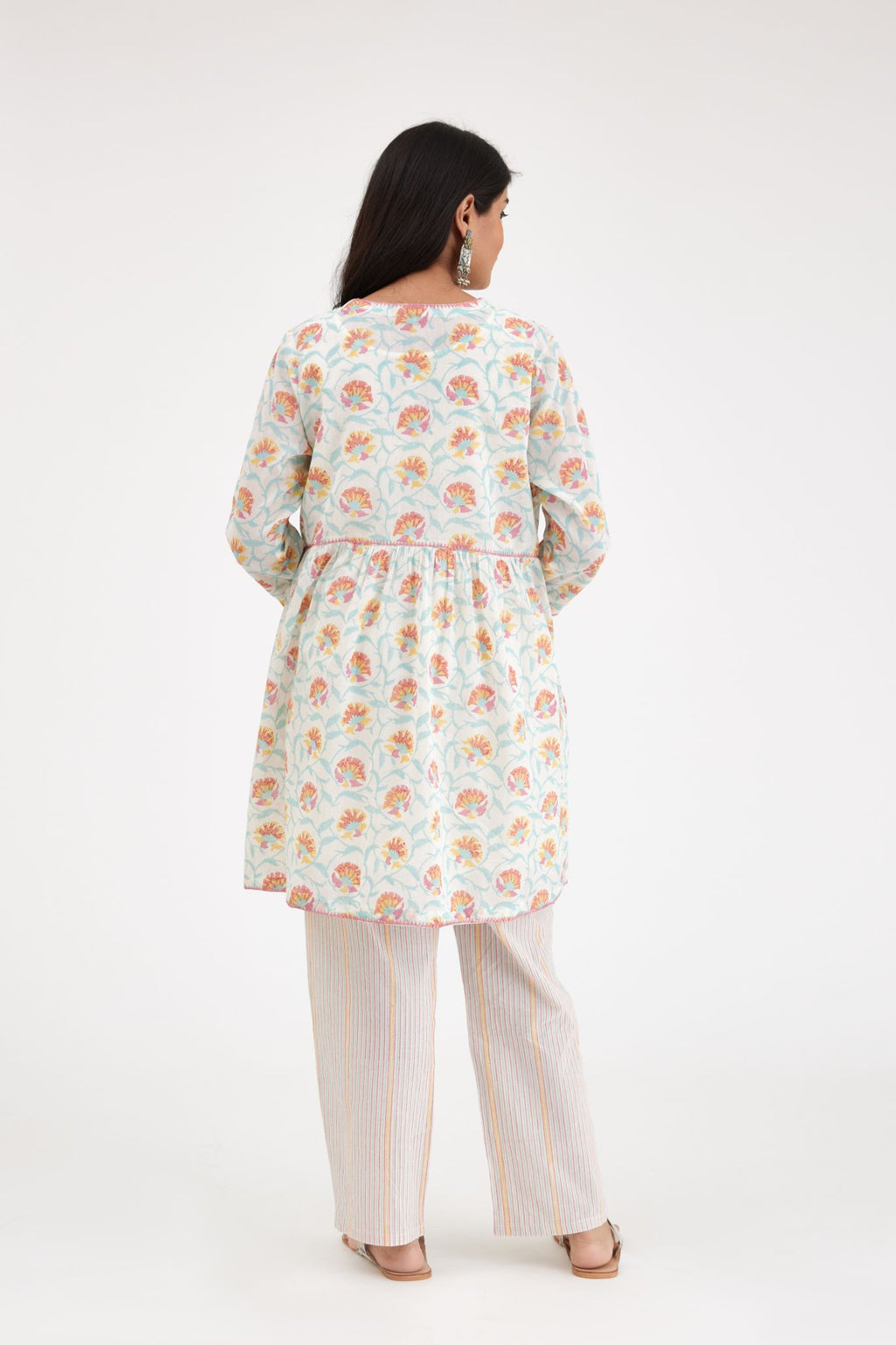 Pink and blue hand blcok printed cotton short kurta, highlighted with zig-zag silk thread embroidery at edges, paired with pink and blue hand-block printed striped cotton comfortable fit pants.