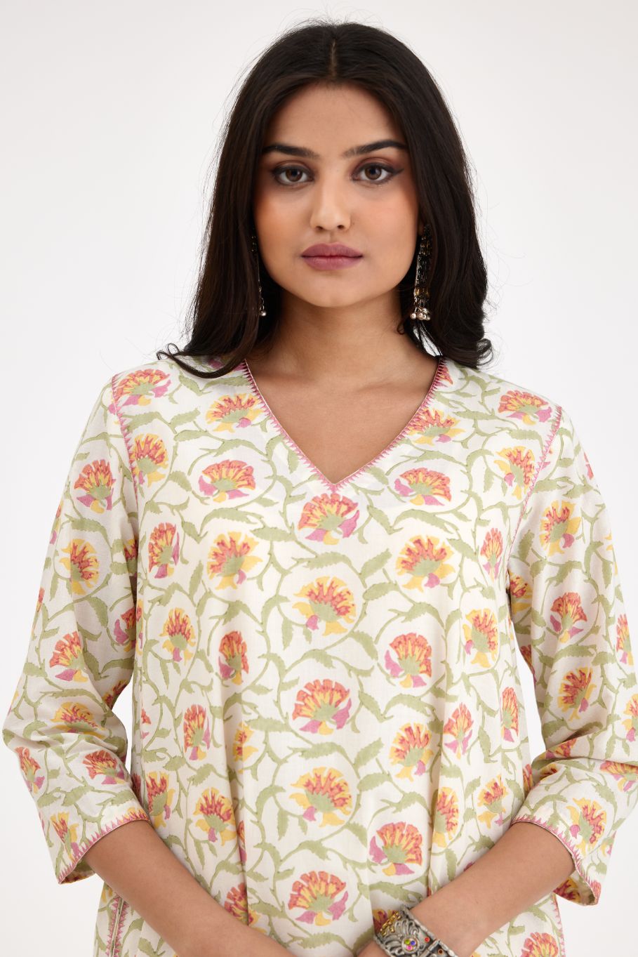 A-line hand block printed pink and green cotton kurta set.