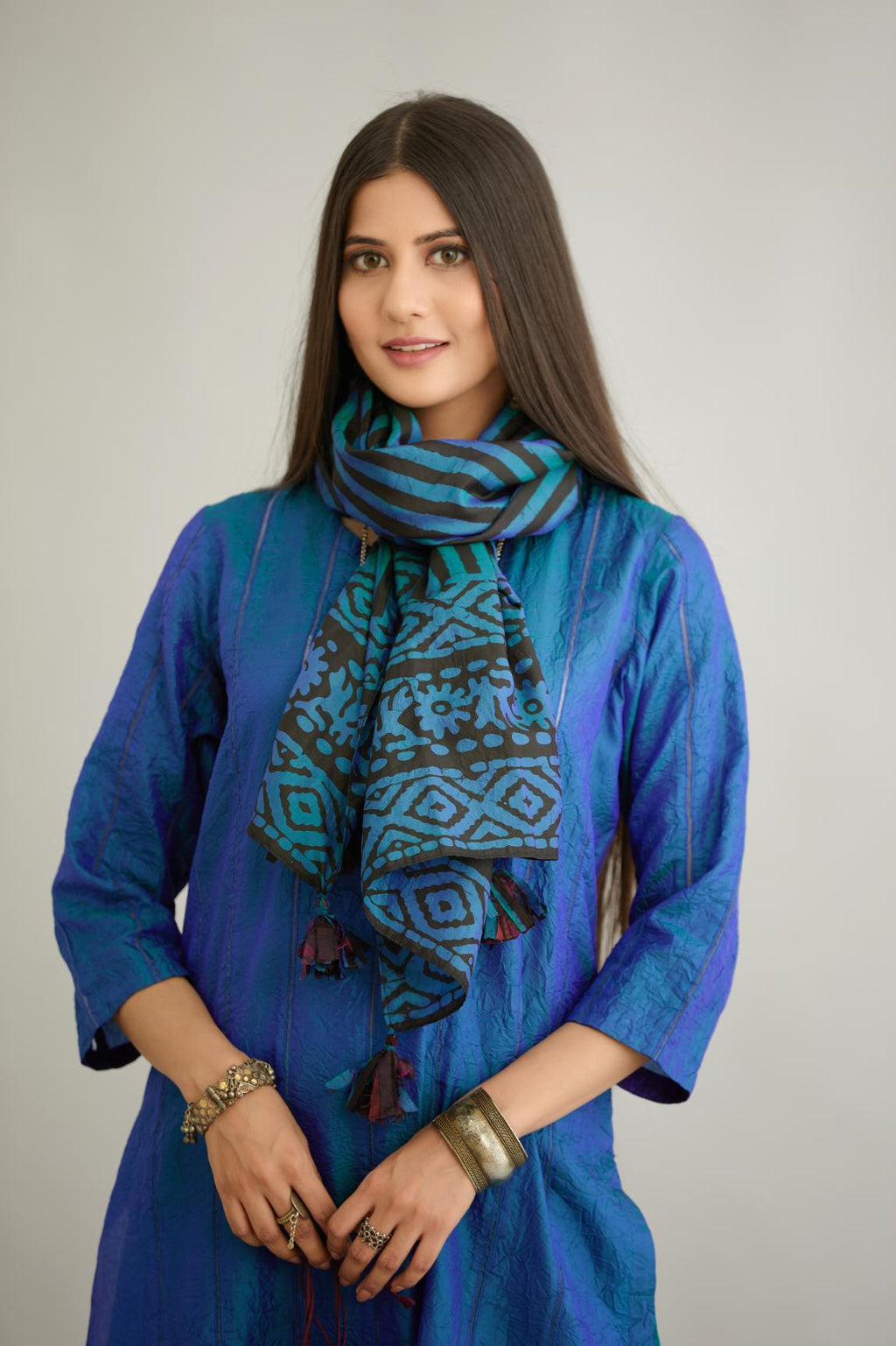 Blue and black batik printed stole with silk fabric tassels at all corners