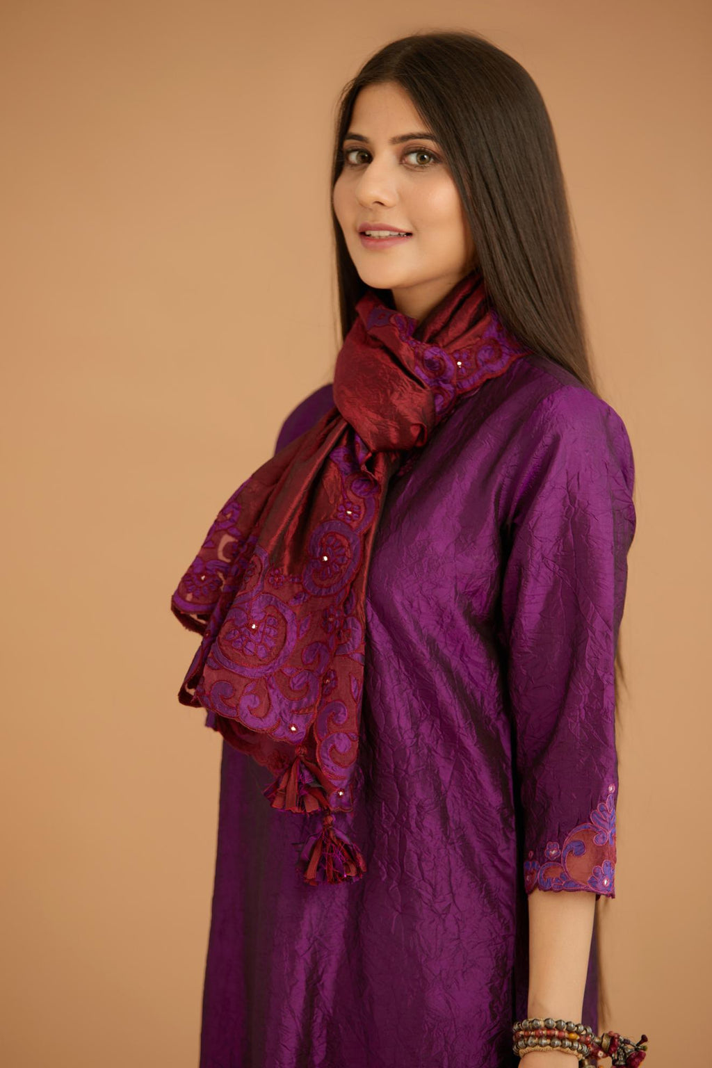 Maroon hand crushed silk stole with silk and organza cutwork embroidery and hand attached mirrors.