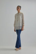 Off white cotton Chanderi top with all-over delicate embroidered pink & beige hand block printed applique flowers, highlighted with sequins and multi coloured beads.