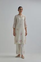Off white straight short kurta set with all-over pink & beige hand block printed appliqué motifs, highlighted with sequins and multi coloured beads.