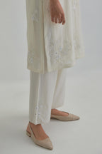Off white straight short kurta set with all-over appliqué motifs, highlighted with sequins and beads.