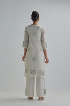 Off white straight short kurta set with all-over blue & beige hand block printed appliqué motifs, highlighted with sequins and multi coloured beads.