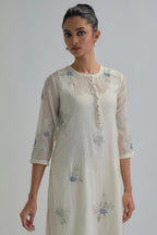 Off white straight short kurta set with all-over blue & beige hand block printed appliqué motifs, highlighted with sequins and multi coloured beads.