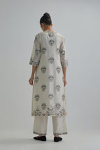 Off White silk Chanderi straight kurta set with all-over floral boota embroidery, highlighted with silver sequins.