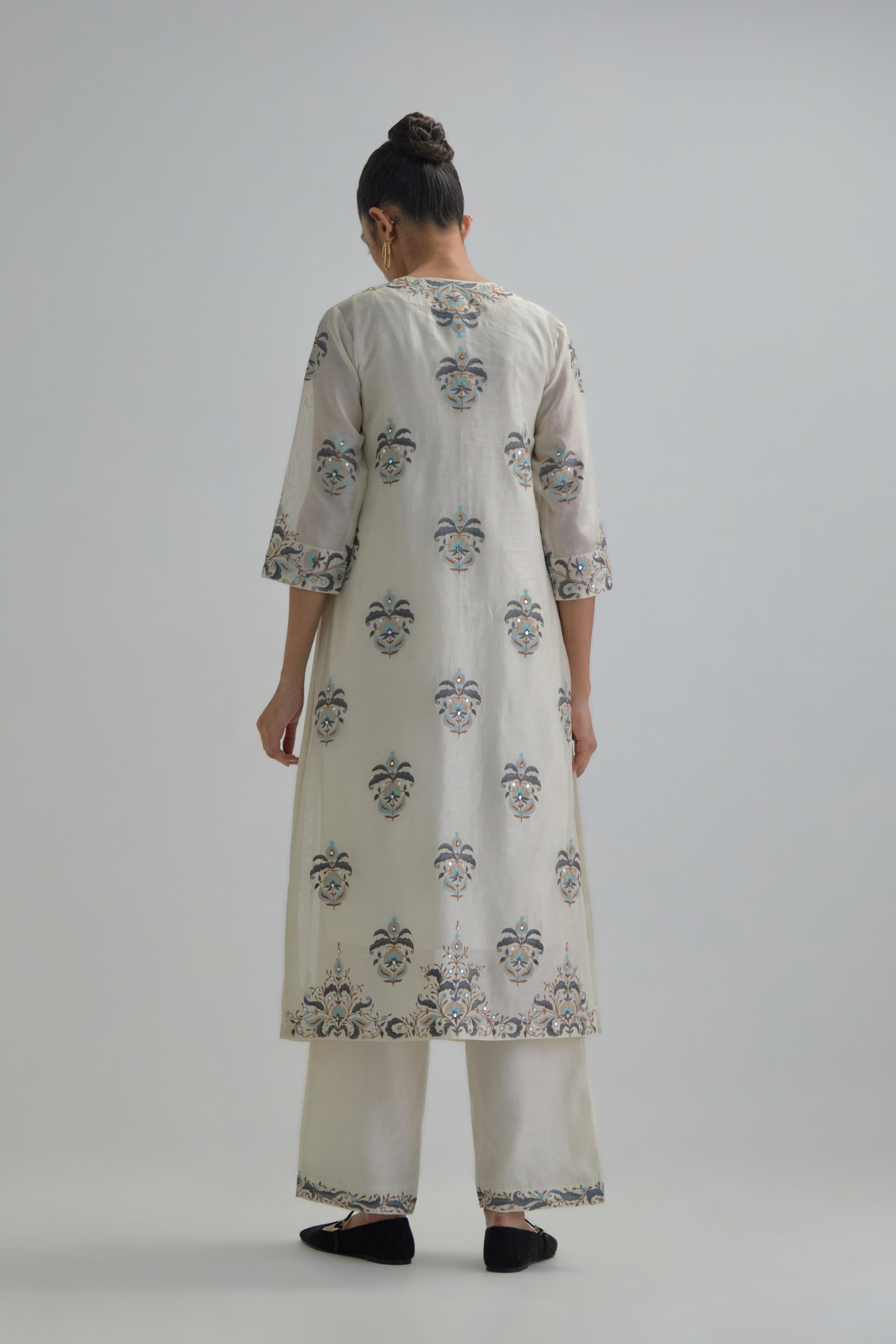 Off White silk Chanderi straight kurta set with all-over floral boota embroidery, highlighted with silver sequins.