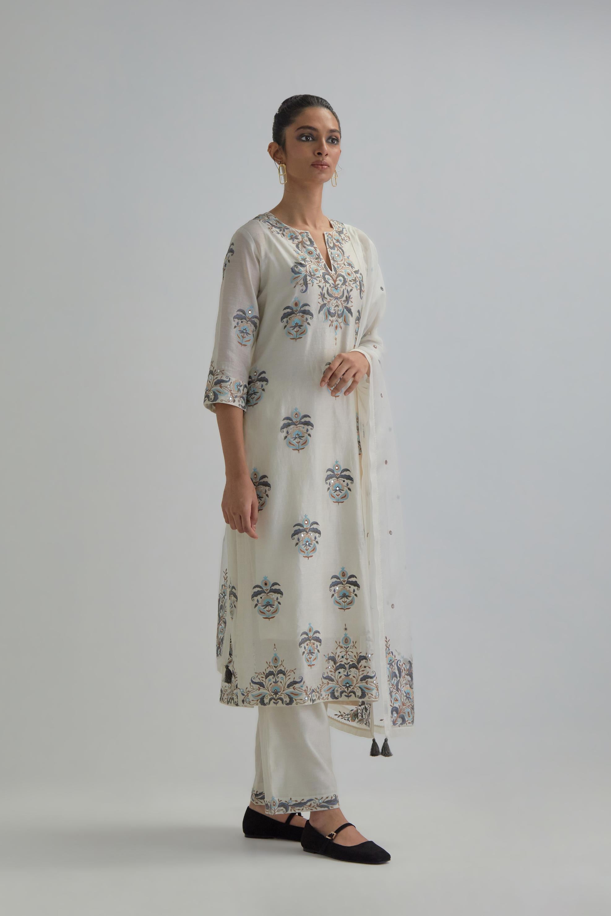 Off White silk Chanderi straight kurta set with all-over floral boota embroidery, highlighted with silver sequins.