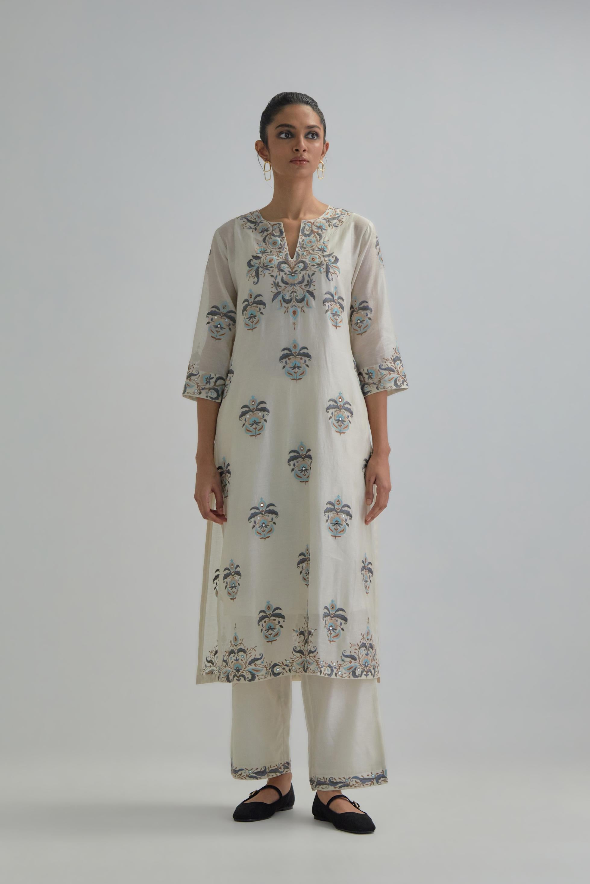 Off White silk Chanderi straight kurta set with all-over floral boota embroidery, highlighted with silver sequins.