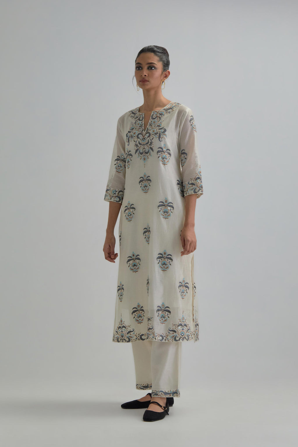 Off White silk Chanderi straight kurta set with all-over floral boota embroidery, highlighted with silver sequins.