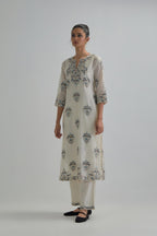 Off White silk Chanderi straight kurta set with all-over floral boota embroidery, highlighted with silver sequins.