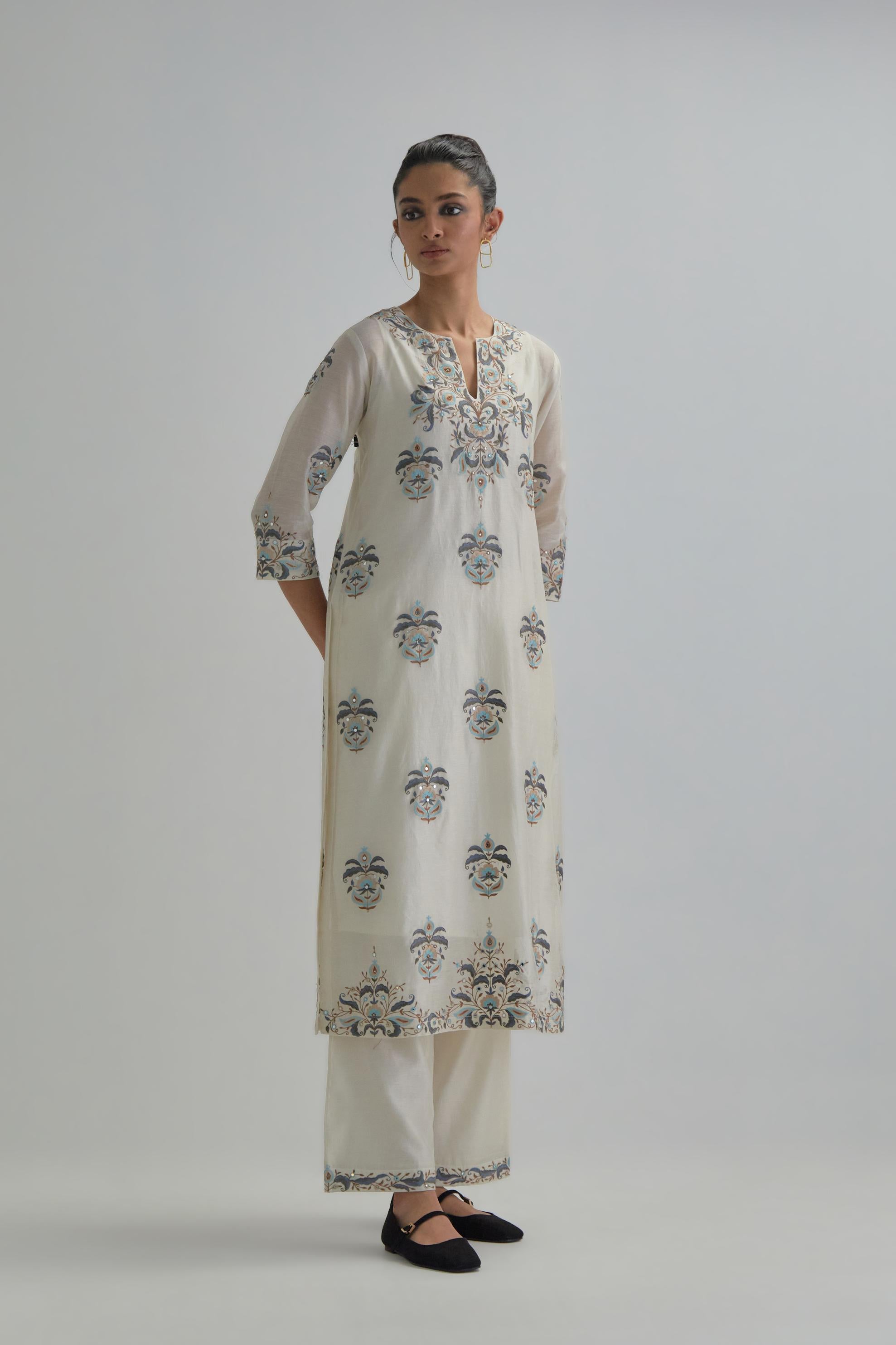 Off White silk Chanderi straight kurta set with all-over floral boota embroidery, highlighted with silver sequins.