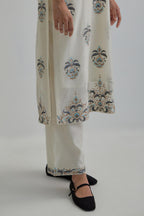 Off White silk Chanderi straight kurta set with all-over floral boota embroidery, highlighted with silver sequins.