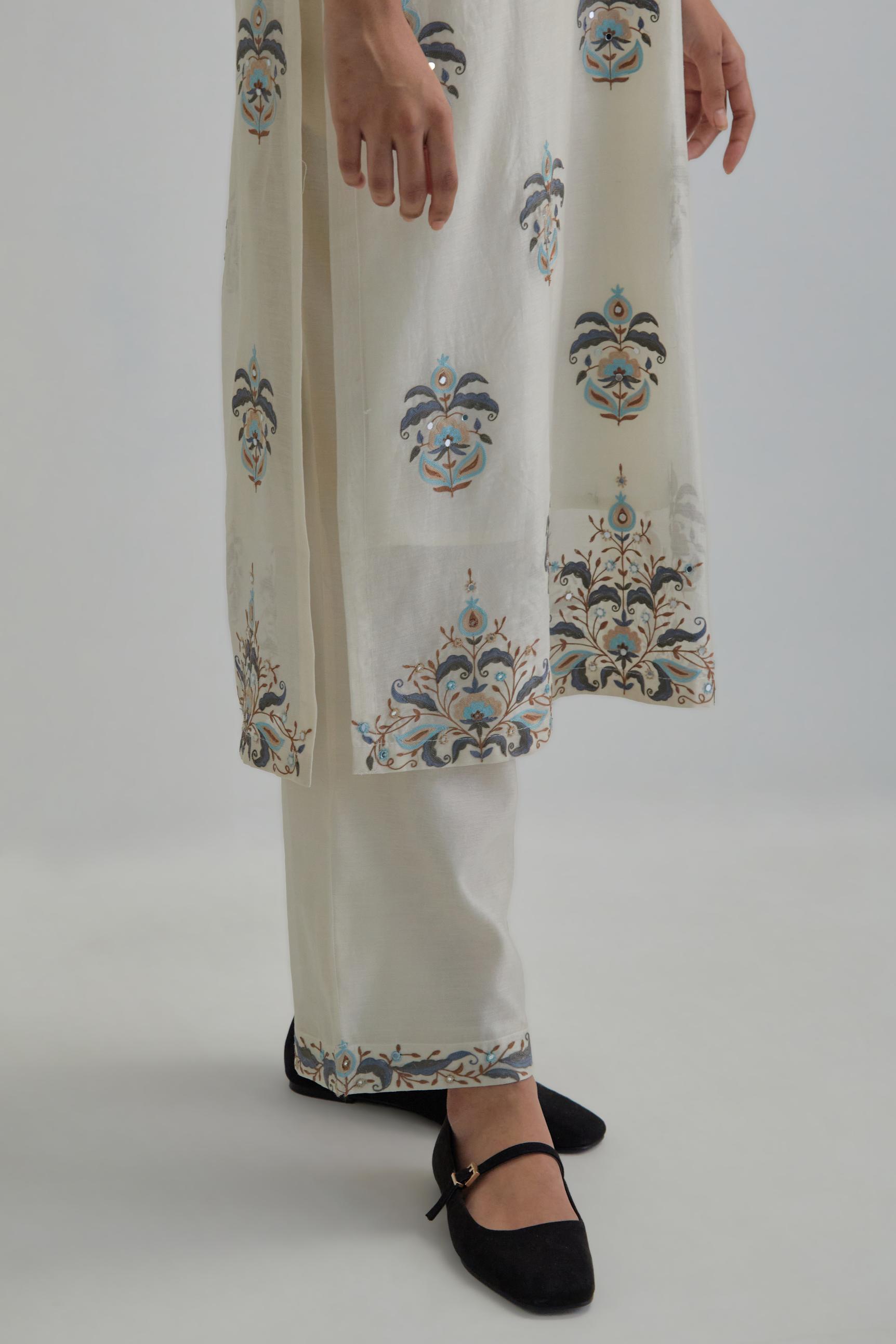 Off White silk Chanderi straight kurta set with all-over floral boota embroidery, highlighted with silver sequins.