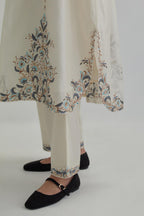 Off white Silk Chanderi easy fit kaftan with earthy coloured thread Aari embroidery, highlighted with silver sequins work, paired with Off white silk Chanderi straight pants with earthy coloured Aari work at hem.