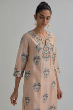 Pink silk Chanderi straight kurta set with all-over floral boota embroidery, highlighted with silver sequins.