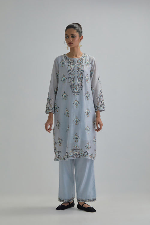 Blue silk Chanderi short kurta set with all-over floral boota embroidery, highlighted with silver sequins.