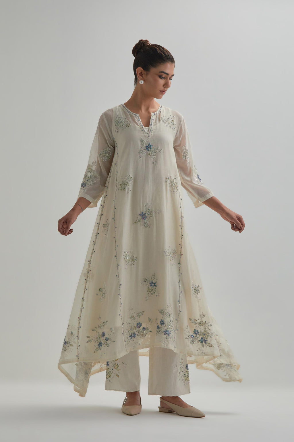 Off-white cotton Chanderi kurta set with asymmetric hem and all-over blue & beige hand block printed appliqué flowers.