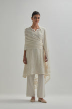 Off white cotton Chanderi short kalidar kurta set with all-over appliqué flowers, highlighted with sequins and beads.
