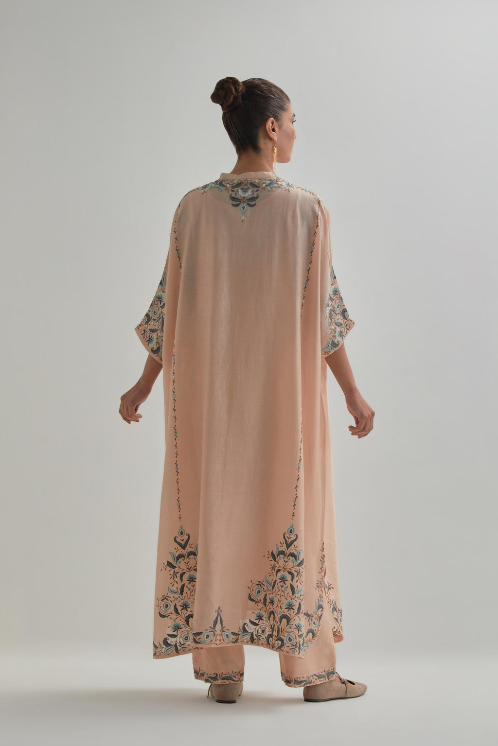 Pink Silk Chanderi easy fit kaftan with earthy coloured thread Aari embroidery, highlighted with silver sequins work, paired with Pink silk Chanderi straight pants with earthy coloured Aari work at hem.