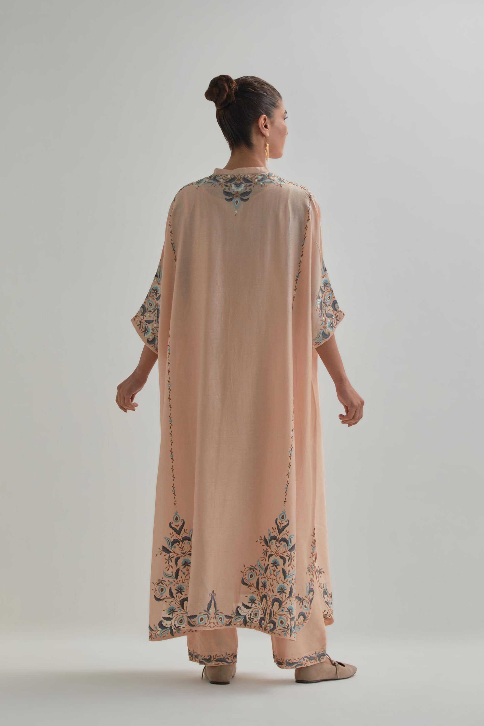 Pink Silk Chanderi easy fit kaftan with earthy coloured thread Aari embroidery, highlighted with silver sequins work, paired with Pink silk Chanderi straight pants with earthy coloured Aari work at hem.