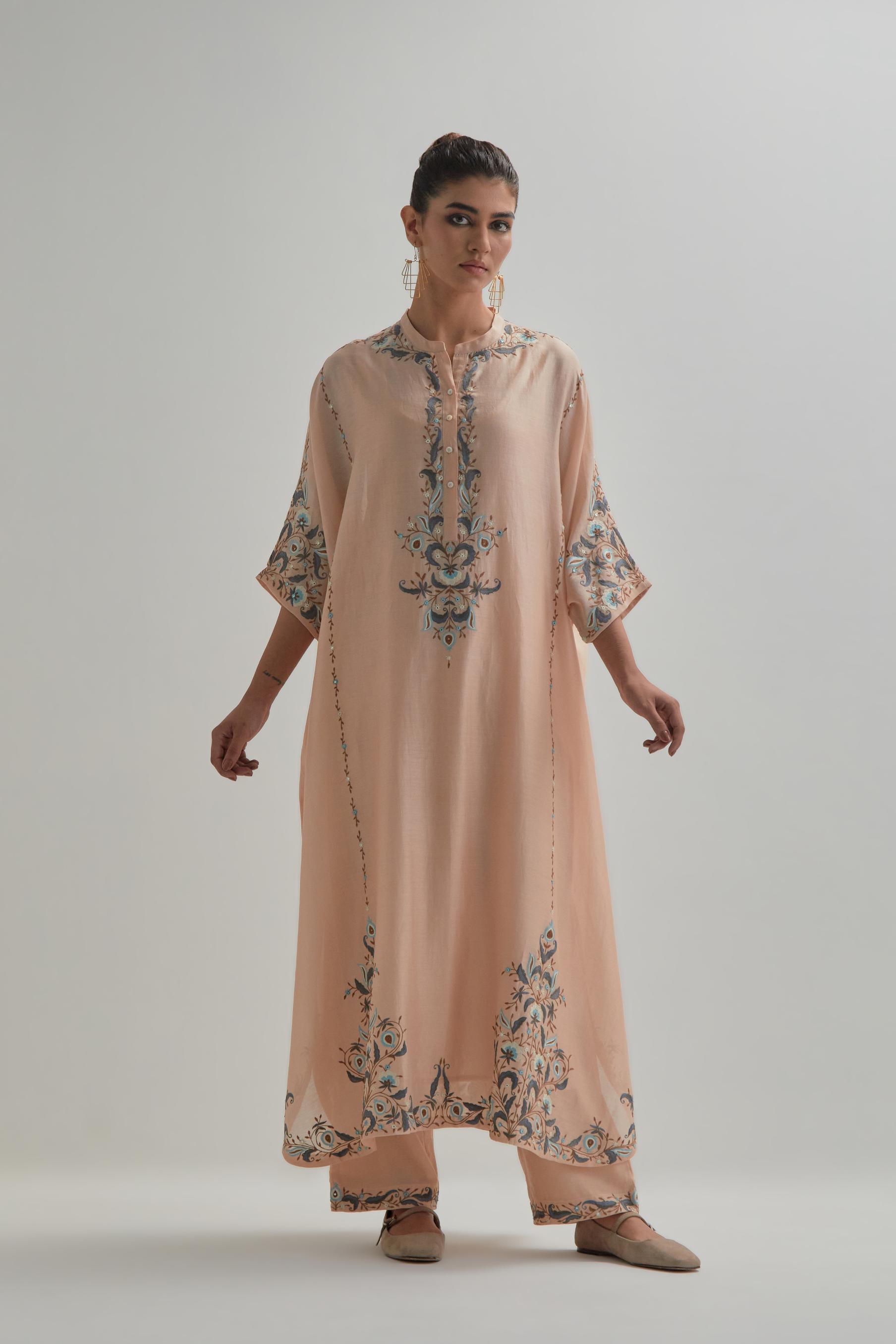 Pink Silk Chanderi easy fit kaftan with earthy coloured thread Aari embroidery, highlighted with silver sequins work, paired with Pink silk Chanderi straight pants with earthy coloured Aari work at hem.