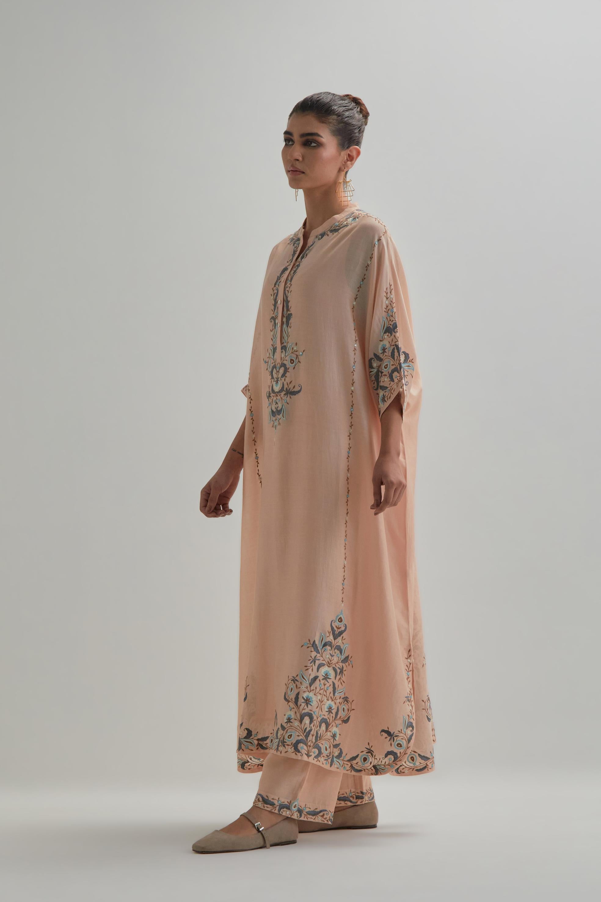Pink Silk Chanderi easy fit kaftan with earthy coloured thread Aari embroidery, highlighted with silver sequins work, paired with Pink silk Chanderi straight pants with earthy coloured Aari work at hem.
