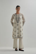 Off White silk Chanderi short kurta set with all-over floral boota embroidery, highlighted with silver sequins.