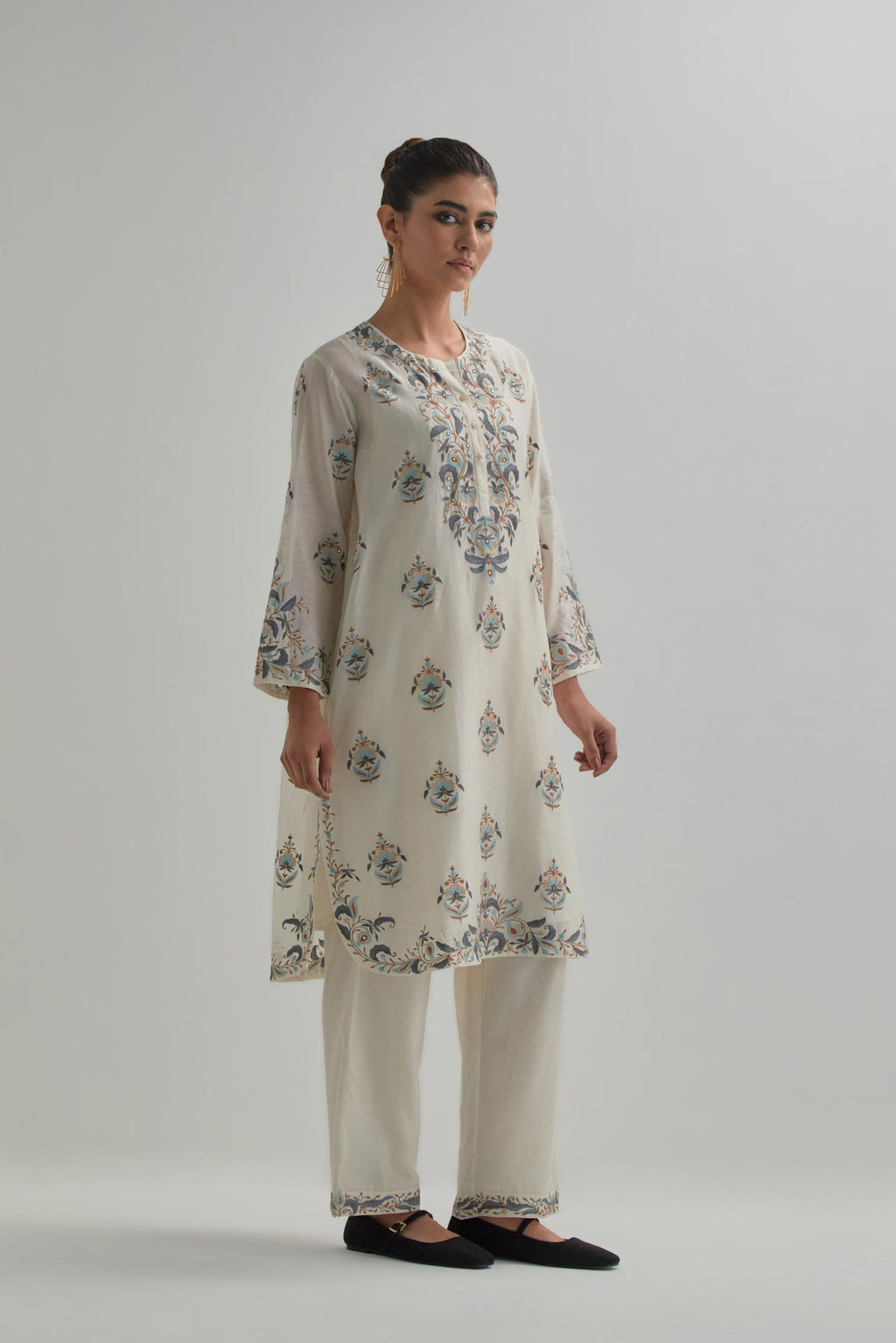 Off White silk Chanderi short kurta set with all-over floral boota embroidery, highlighted with silver sequins.