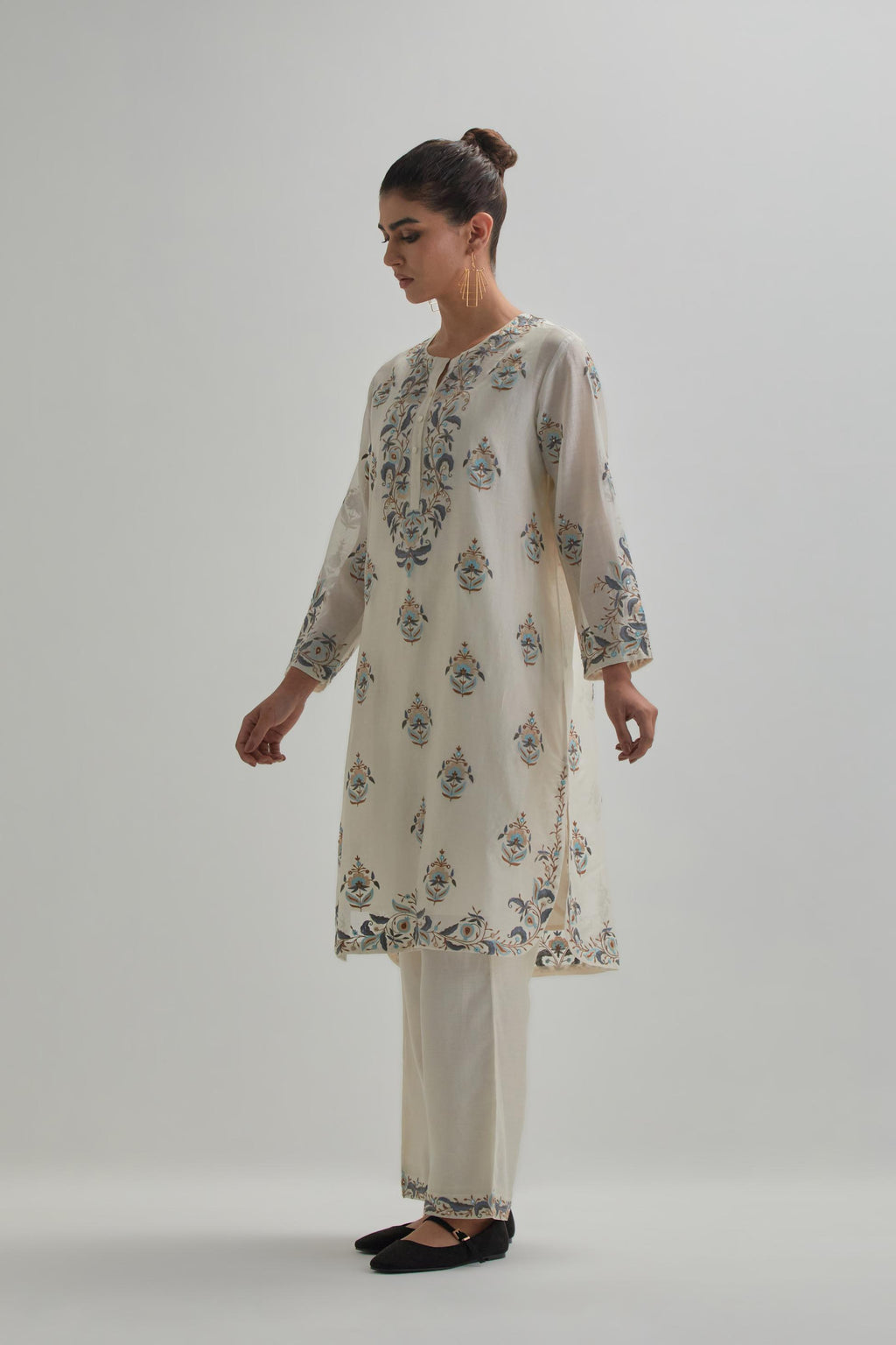 Off White silk Chanderi short kurta set with all-over floral boota embroidery, highlighted with silver sequins.