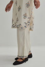 Off White silk Chanderi short kurta set with all-over floral boota embroidery, highlighted with silver sequins.