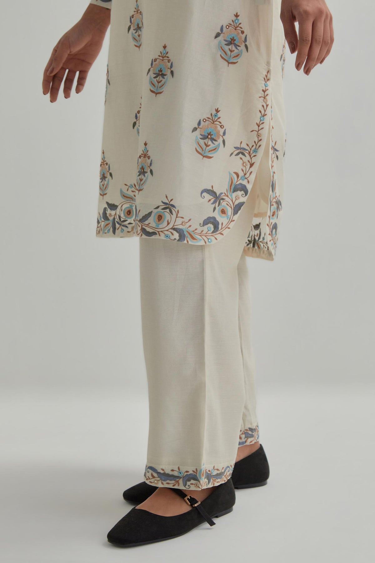 Off White silk Chanderi short kurta set with all-over floral boota embroidery, highlighted with silver sequins.