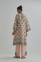 Pink silk Chanderi straight hem mid-length abha style kurta set with bold appliqué embroidery along with earthy-coloured Aari thread work and tassels.