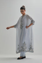Blue Silk Chanderi easy fit kaftan with earthy coloured thread Aari embroidery, highlighted with silver sequins work, paired with Blue silk Chanderi straight pants with earthy coloured Aari work at hem.