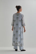 Blue silk Chanderi straight kurta set with all-over floral boota embroidery, highlighted with silver sequins.
