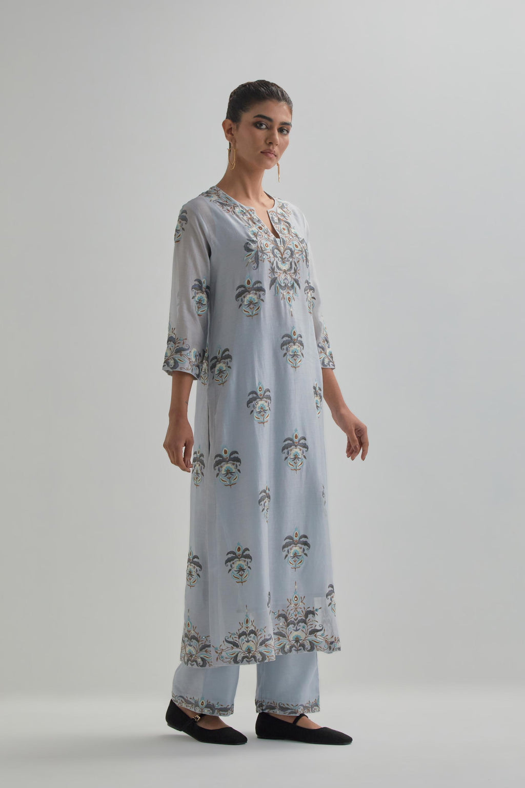Blue silk Chanderi straight kurta set with all-over floral boota embroidery, highlighted with silver sequins.