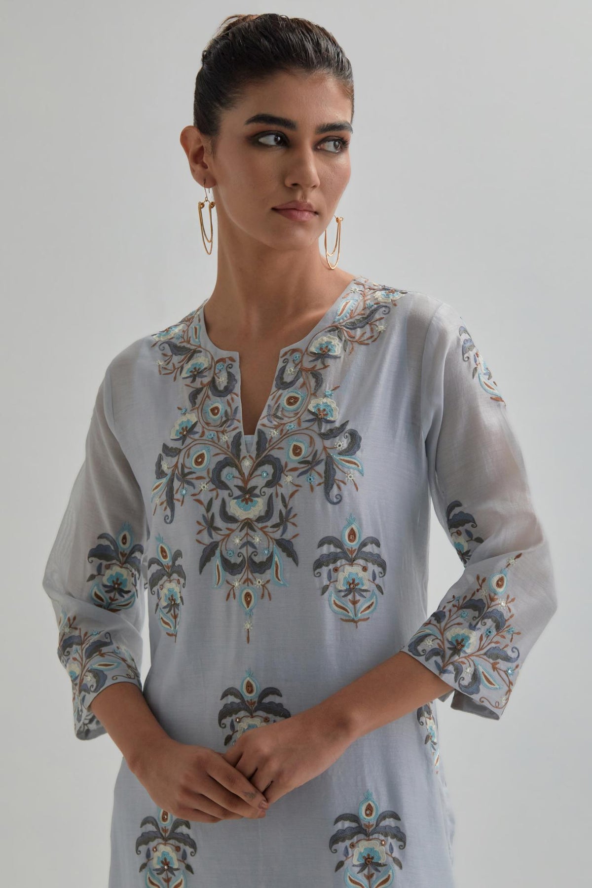 Blue silk Chanderi straight kurta set with all-over floral boota embroidery, highlighted with silver sequins.