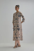 Pink straight kurta set, fully embroidered with bold appliqué flowers, earthy-coloured Aari thread work and silk tassels.